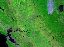 California, USA  On this 100 m image taken at 16 September 2014, a large smoke plume in northern California (Union Valley reservoir region) can be seen in the upper right part. The plume was caused by a wildfire, which doubled in size in just 12 hours. Thousands of people were forced to leave their homes. The wildfire – known as the 'King' – was the biggest of 11 fires, in what officials described as the worst wildfire season on record.   Date: 16/09/2014   Resolution: 100m : fire, America