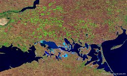 Askania Nova, Ukraine  On the 100 m false-colour image of 5 September 2015, the nature reserve can be recognised in the centre by the brown-green colours. The area is surrounded by pivot irrigation fields (mainly for corn and wheat growth), visible as bright green circular shapes. Further, several saline lakes can be seen as light-blue areas, while in the upper-left part the Dnjepr River is visible.   Date: 05/09/2015   Resolution: 100m : askania, nova, ukraine