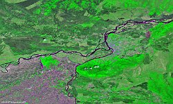Amur and Ussuri Rivers  Together with the Ussuri River, the Amur River, tenth longest in the world, forms part of the border between the Russian Far East and northeastern China, until their confluence near Khadarovsk (highlighted in bright purple spots in this mid-May image). After that, the river continues its way to the northeast, spreading out into a braided character as it passes through a wide valley. The Heilong Jiang province of China, on the south bank, and the Amur Oblast in Russia on the north side, are both named after the river, which continues to play an important geo-political role. The “Black River” or “Black Dragon River”, after the local historical Manchu name and current Chinese name of the river, is the only river in the world where subtropical Asian fish, such as snakehead, coexist with Arctic Siberian fish such as pike. The largest species is the kaluga, that can attain an astounding 5.6m in length.   Date: 18/05/2018   Resolution: 100m : amur, ussuri, river, russia, china, manchu